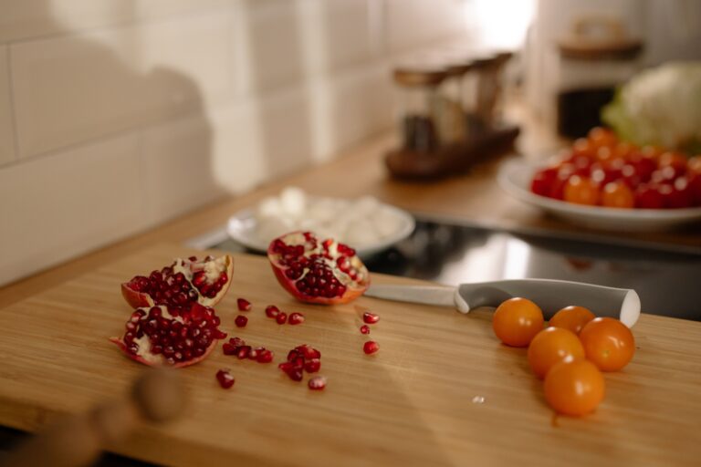 Pantry Decanting System: 5 Amazing Ways To Preserve Freshness (Proven Guide) 4 Fresh pomegranate and cherry tomatoes on a wooden cutting board for pantry decanting system food storage