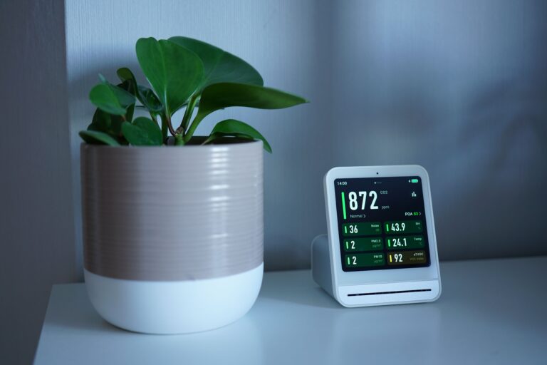 Matter Protocol Smart Home Devices: 9 Amazing Ways to Futureproof Your Home (Proven Guide) 3 Matter protocol smart home devices display on a white desk next to a green plant