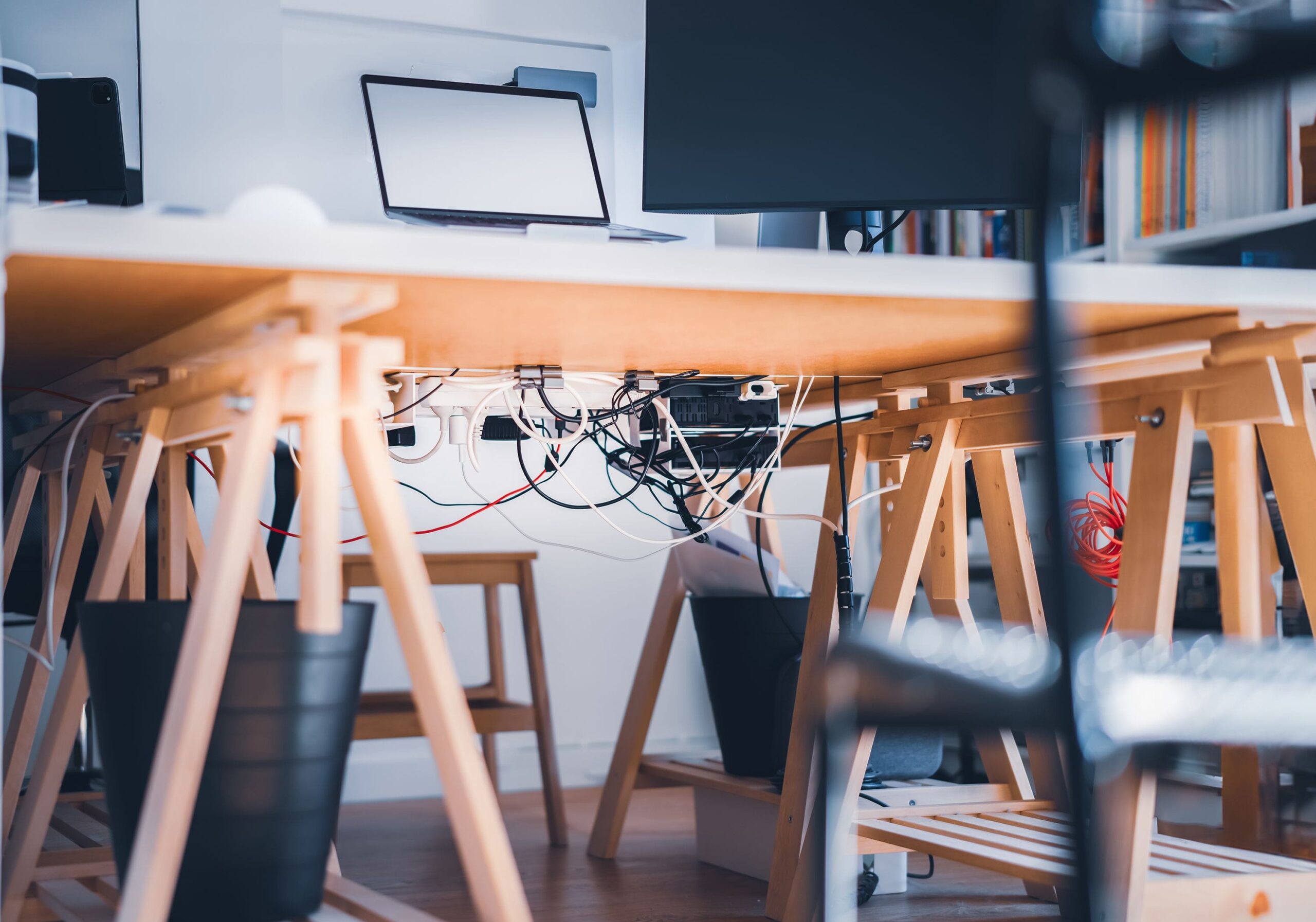5 Hidden Costs of Cable Clutter (and How to Fix It) 1 cable clutter tangled cords under desk workspace
